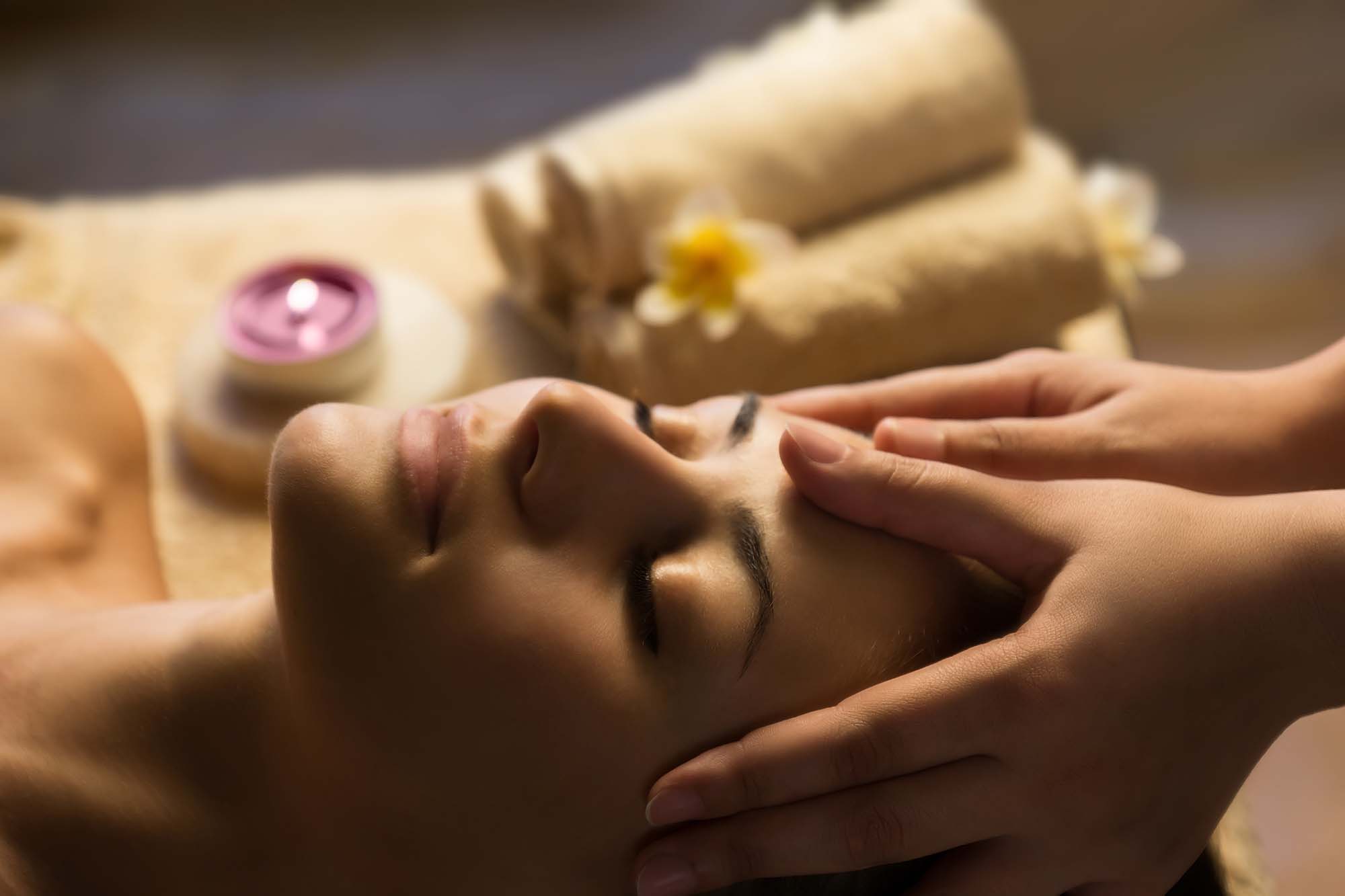 Facial SPA massage. Beautiful woman getting spa treatment. Facial massage